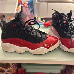 Black and Red Jordan Sneakers with Athletic Silhouette